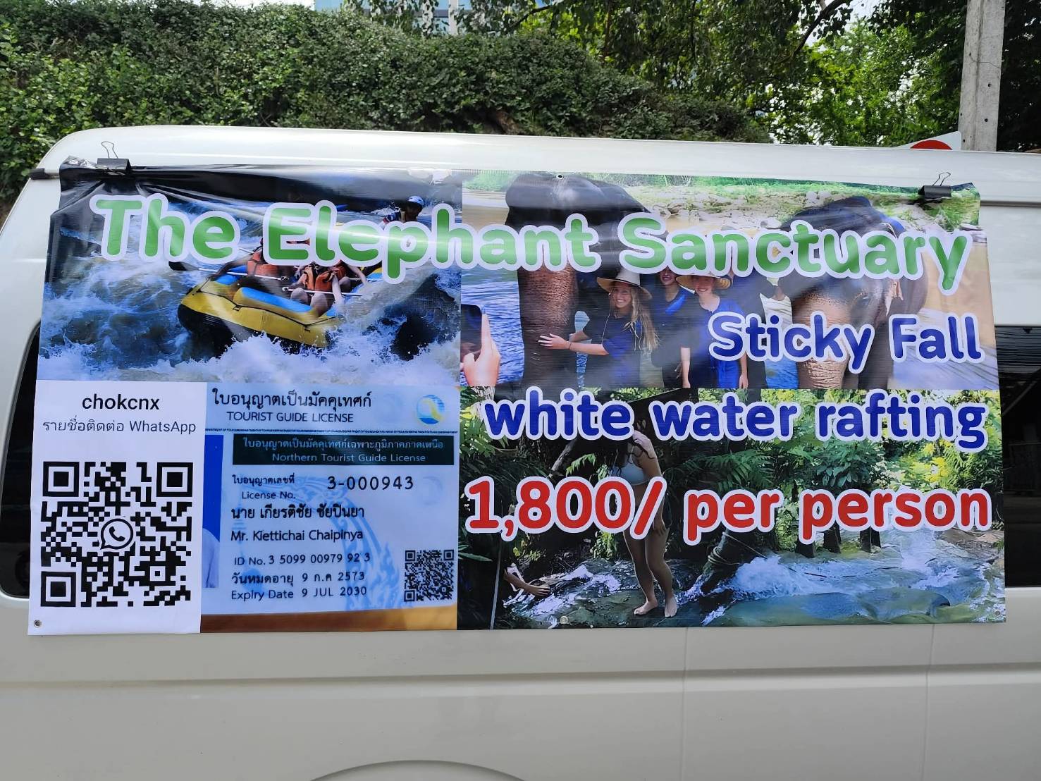 Chok CNX tour banner on the van showing the elephant sanctuary, Sticky Fall and white water rafting for 1,800 baht per person